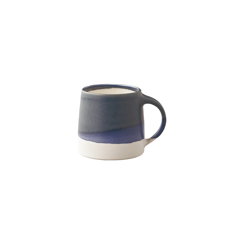 Blue and white ceramic mug on a white background