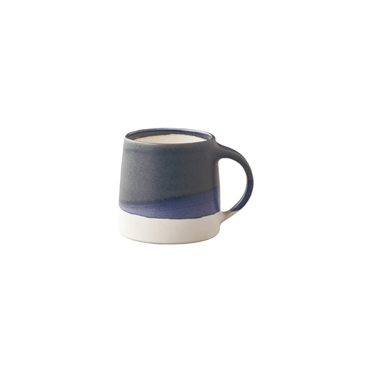 Blue and white ceramic mug on a white background